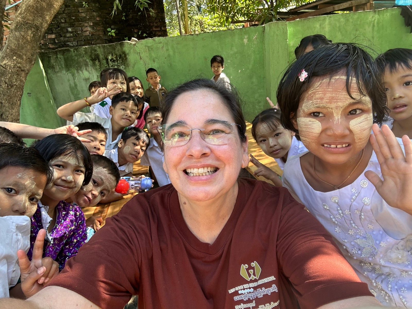 Team member with children during education session